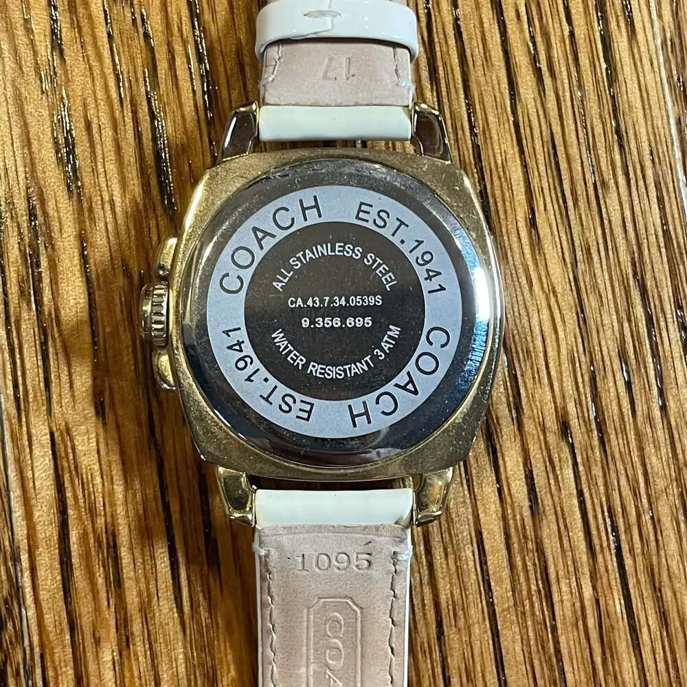 Coach Boyfriend Gold Tone Crystal Bezel Watch with White Strap